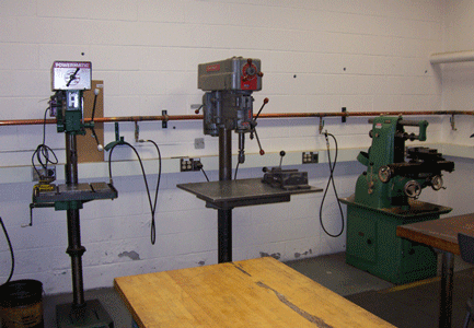 view of shop drill presses