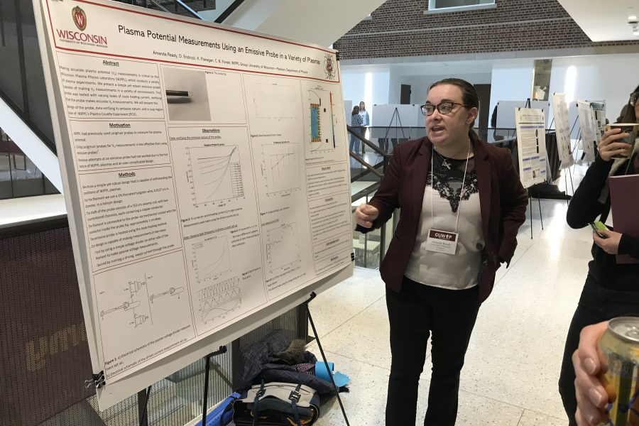 Amanda Ready presents a poster on plasma physics research
