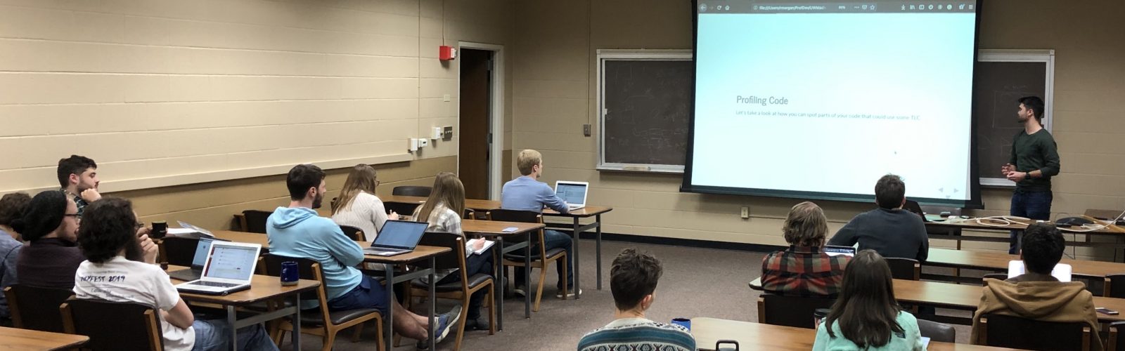 a conference room with students viewing a professional development presentation