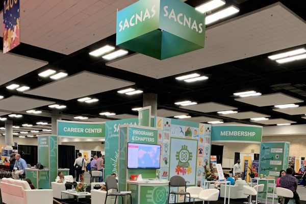 the conference hall at SACNAS 2020 with booths visible, no people in the shot, and a large SACNAS banner at the top