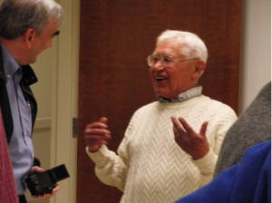 Barney Webb is animatedly chatting with Dan Gelatt