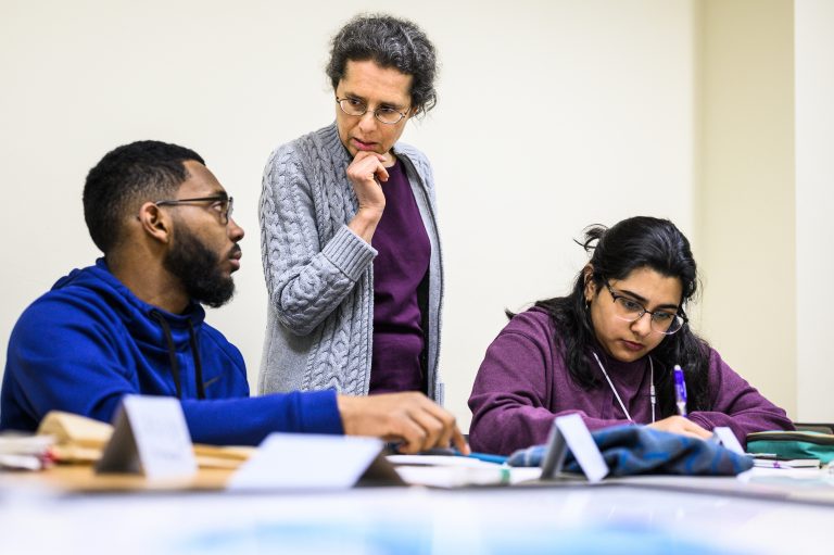 Susan Nossal, director and founder of the Physics Learning Center (PLC), works on optical calculations with undergraduate students Matthew McAllister and Hanna Khan in a classroom at Chamberlin Hall at the University of Wisconsin-Madison on April 3, 2019. Nossal is one of nine recipients of a 2019 Academic Staff Excellence Award (ASEA). (Photo by Jeff Miller / UW-Madison)