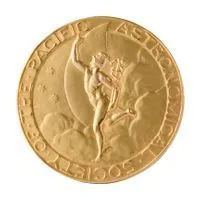 a gold medal that says astronomical society of the pacific around the rim and has an antiquity-looking woman and other details