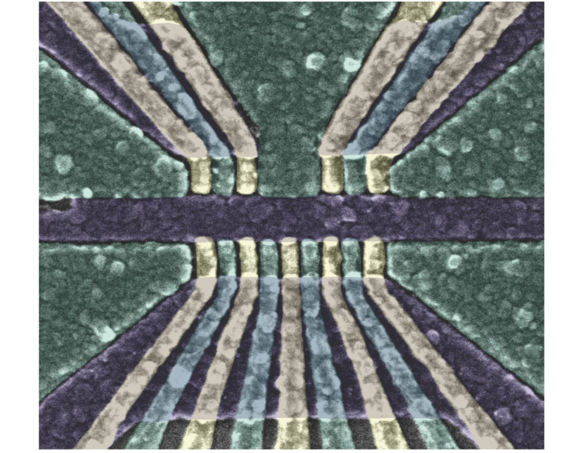 a geometric pattern of lines in green, light gold, and black/dark purple, representing the qubit