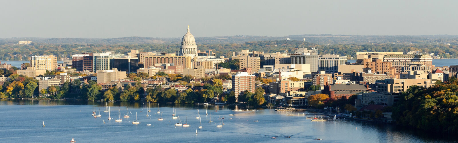 an aerial shot of the UW–Madison campus and downtown Madison, with Lake Mendota in the foreground