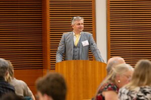 a man stands at a podium