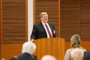 a man stands at a podium