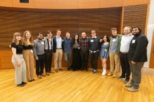 many students pose in a semi-circle