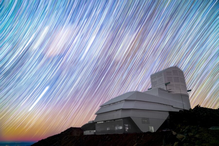 an observatory on top of a hill with "movement" of stars captured on a long exposure
