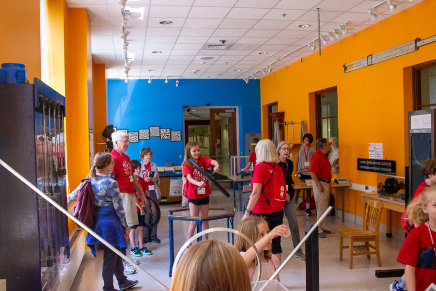 people explore the exhibits of the physics museum