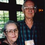a man and woman stand next to each other