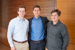 three people standing