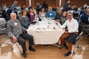 people sitting around a dinner table