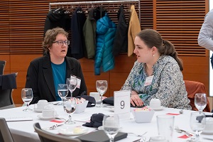 people sitting around a dinner table