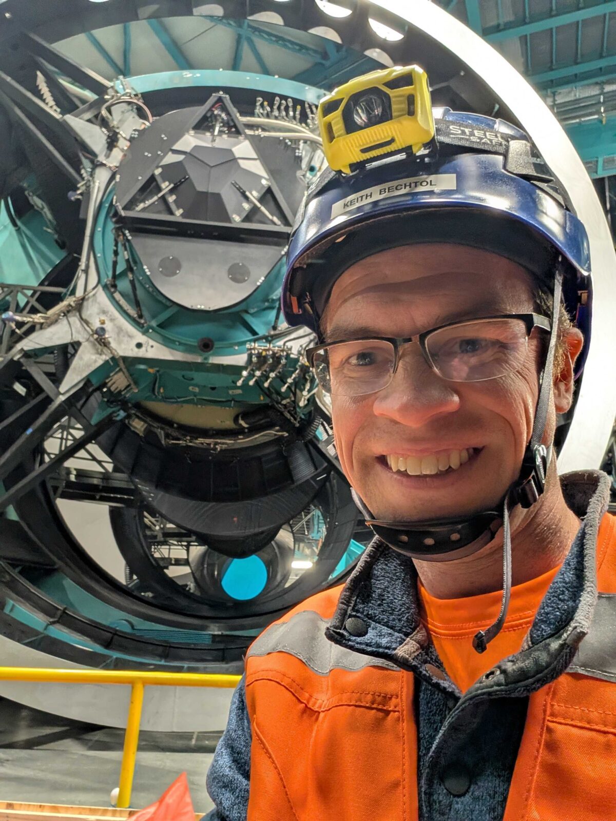 Professor Bechtol in front of equipment