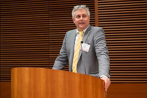 a man stands at the podium